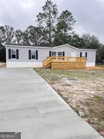 a view of a big yard with a house