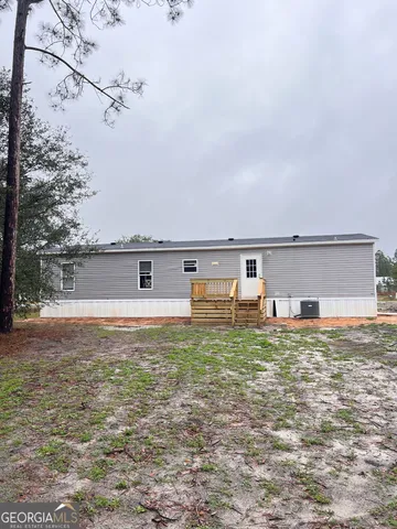 a view of a yard with a tree