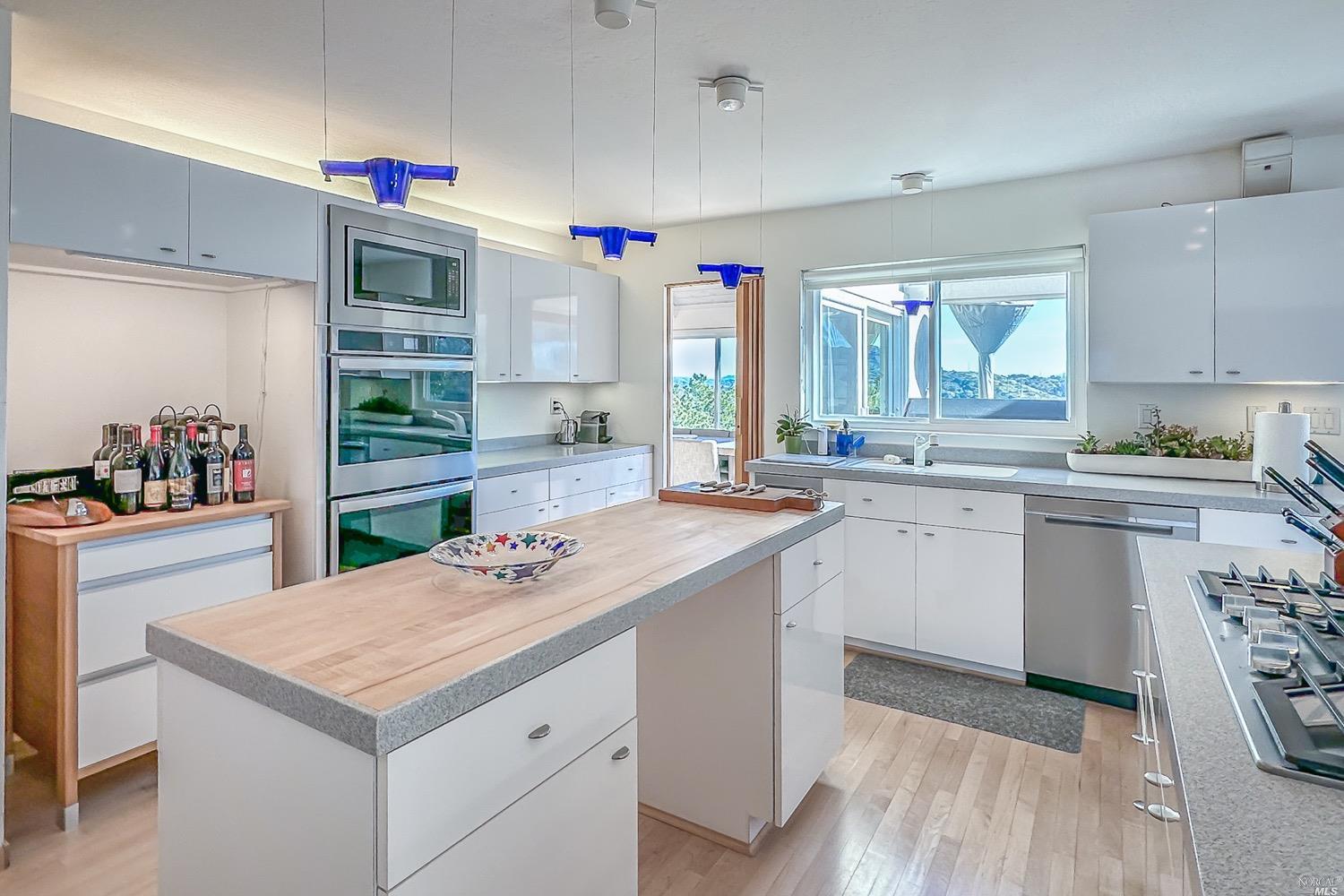 432 Durant Way Mill Valley, CA 94941 - Photo 26 of 69 a kitchen with a sink stove and cabinets