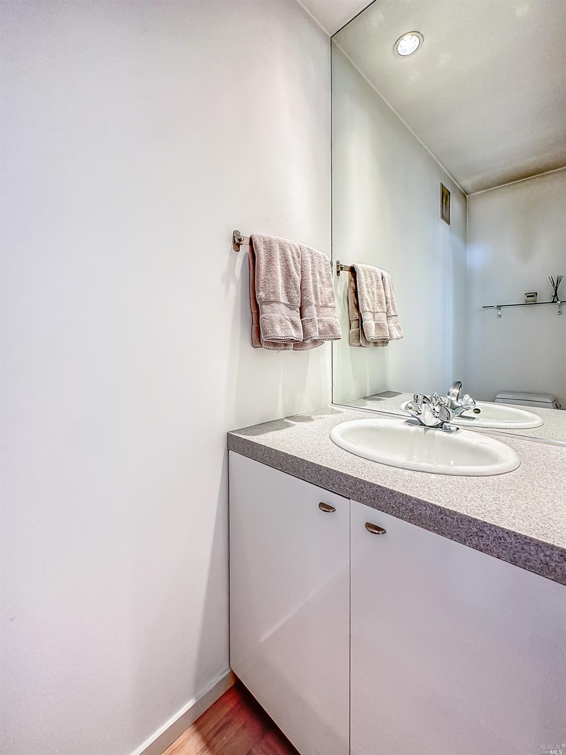 432 Durant Way Mill Valley, CA 94941 - Photo 28 of 69 a bathroom with a granite countertop sink and a mirror