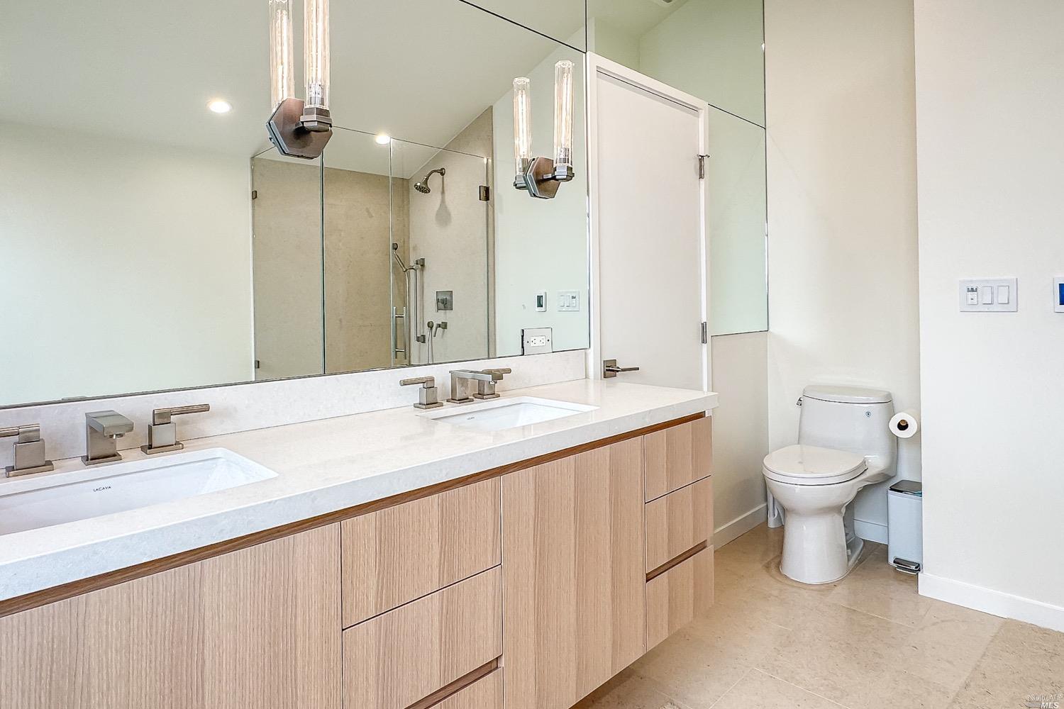 432 Durant Way Mill Valley, CA 94941 - Photo 36 of 69 a bathroom with a granite countertop sink a toilet and a mirror
