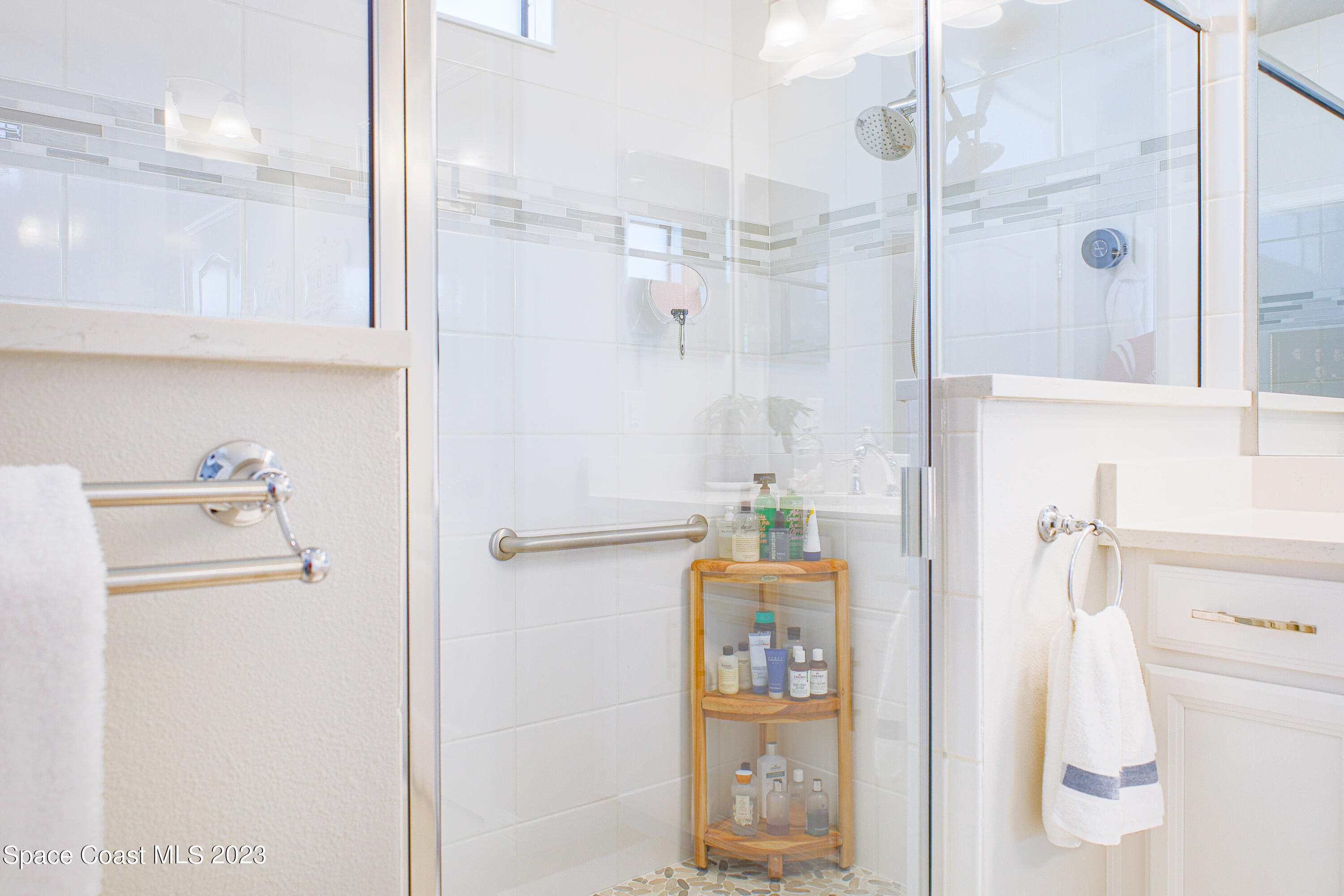 3349 Ribbon Grass Drive Melbourne, FL 32940 - Photo 11 of 45 a bathroom with a shower and a sink
