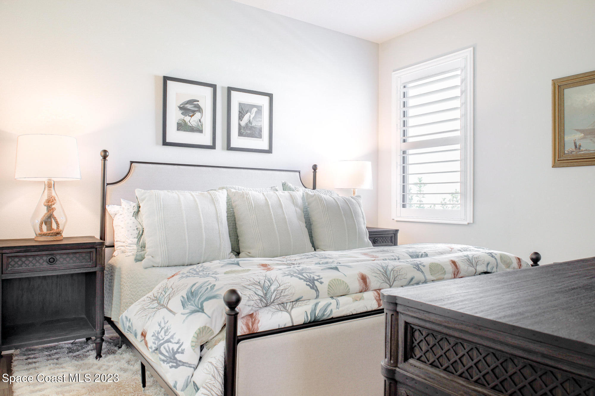 3349 Ribbon Grass Drive Melbourne, FL 32940 - Photo 12 of 45 a bed room with double bed and a window