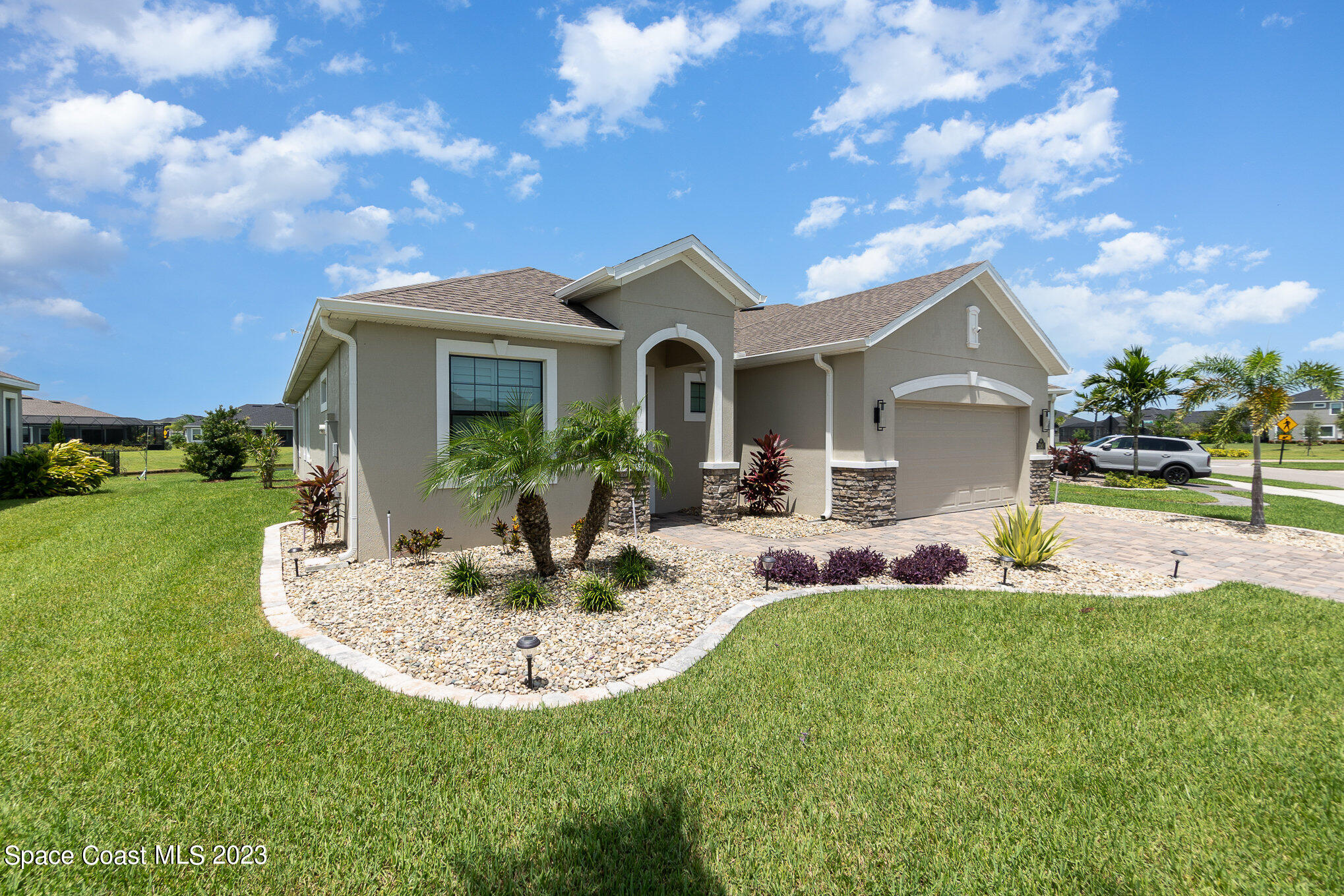 3349 Ribbon Grass Drive Melbourne, FL 32940 - Photo 21 of 45 a view of a house with a big yard plants and large tree