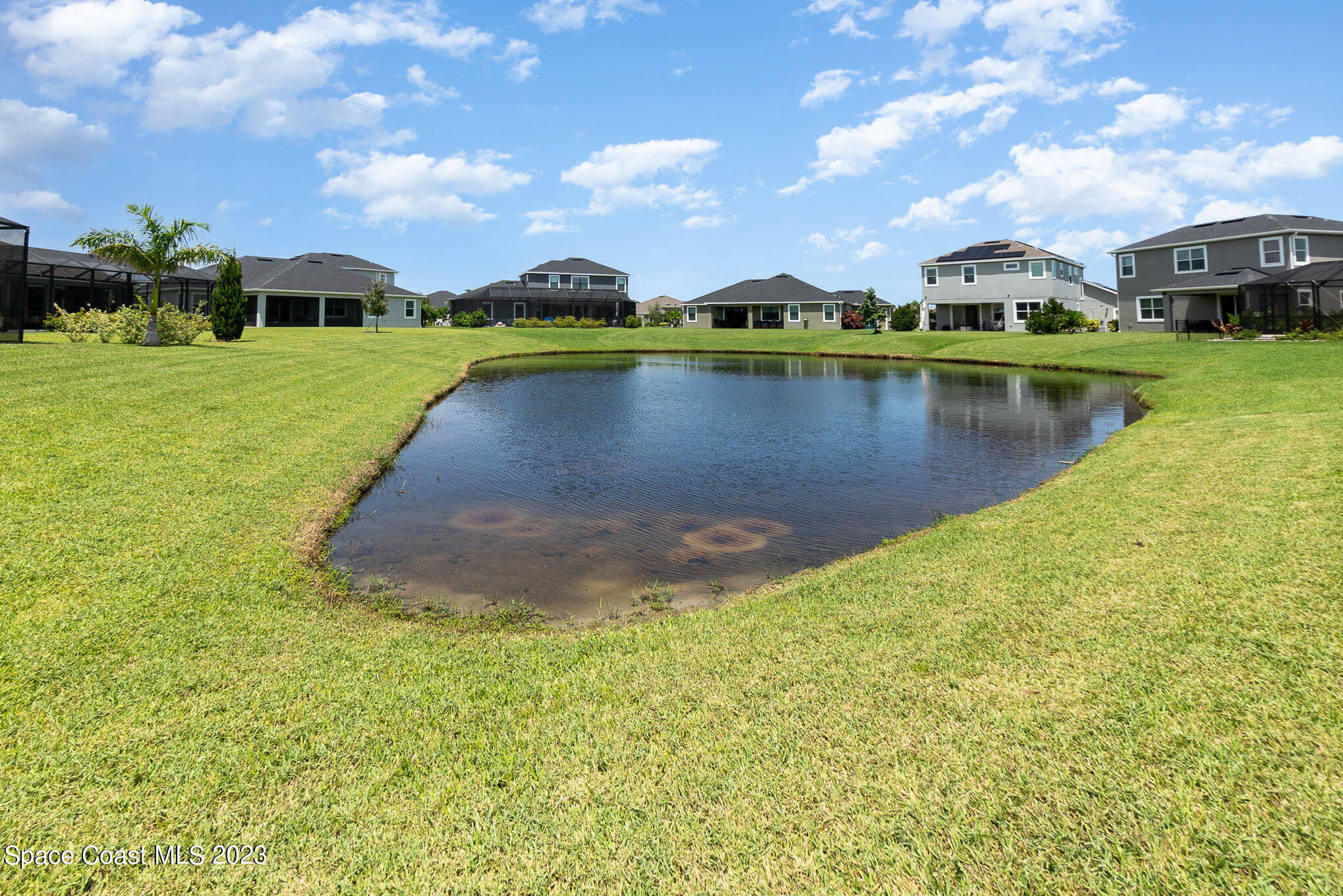 3349 Ribbon Grass Drive Melbourne, FL 32940 - Photo 22 of 45 a view of a lake with houses