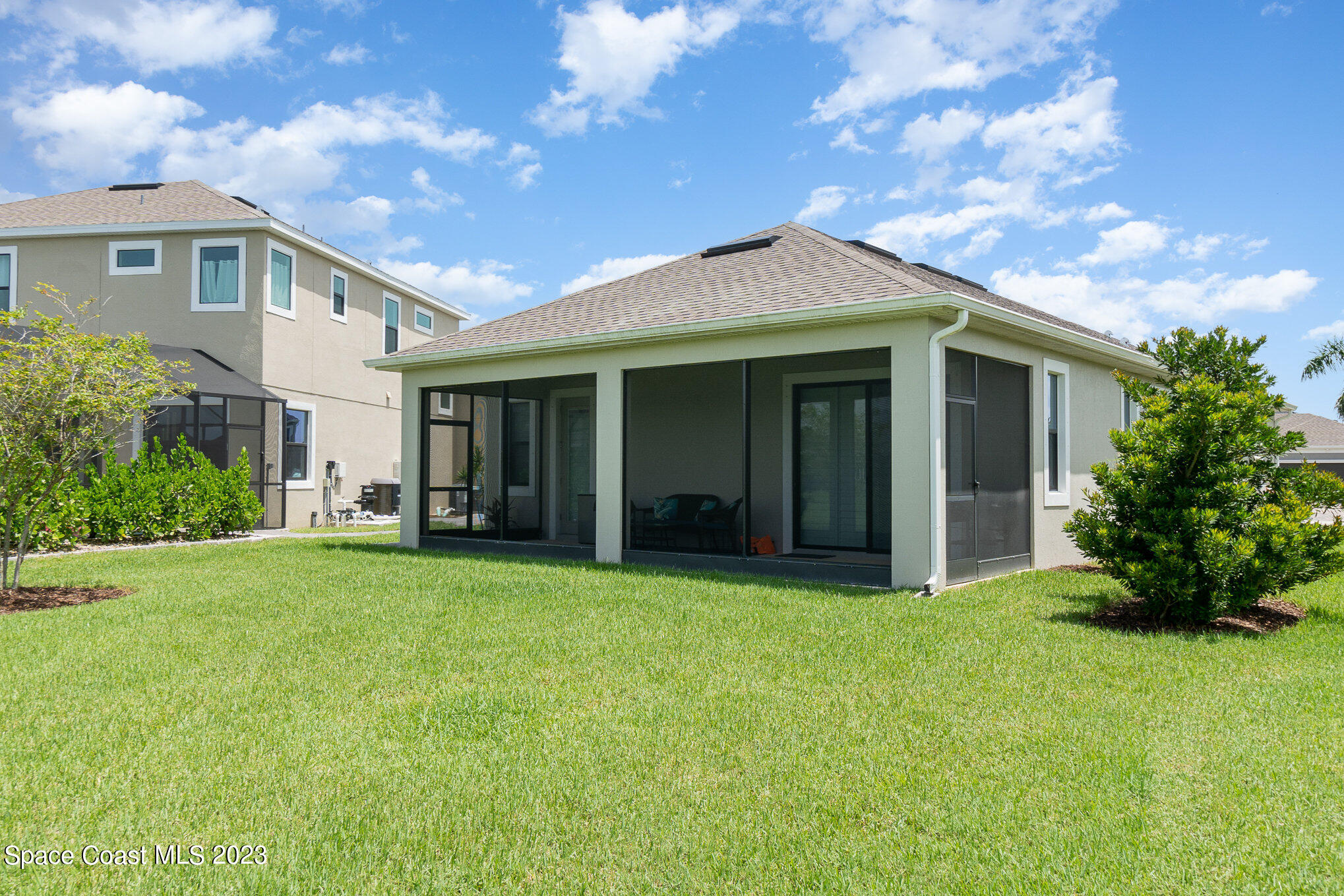 3349 Ribbon Grass Drive Melbourne, FL 32940 - Photo 23 of 45 a front view of a house with a garden