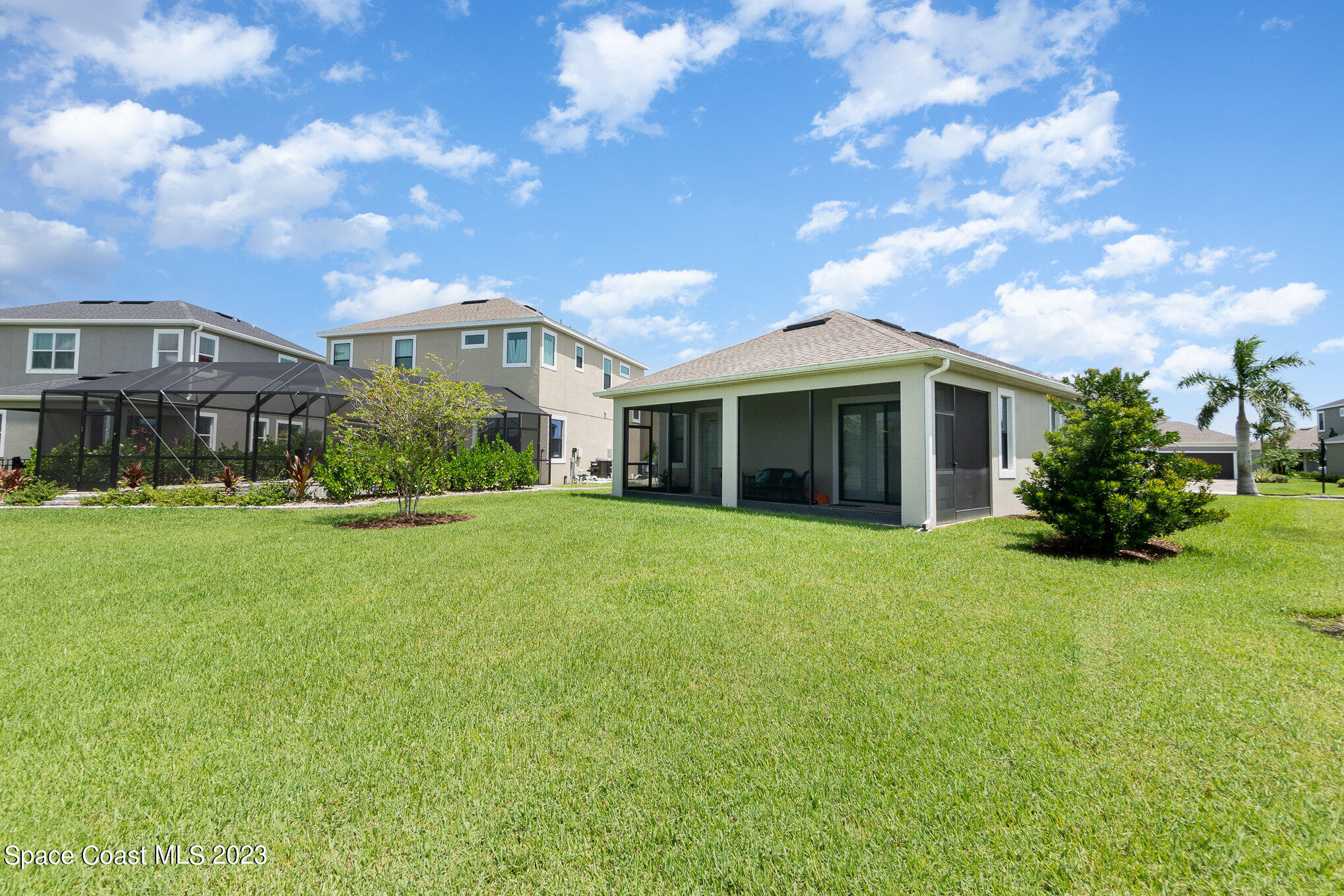 3349 Ribbon Grass Drive Melbourne, FL 32940 - Photo 24 of 45 a front view of a house with a garden