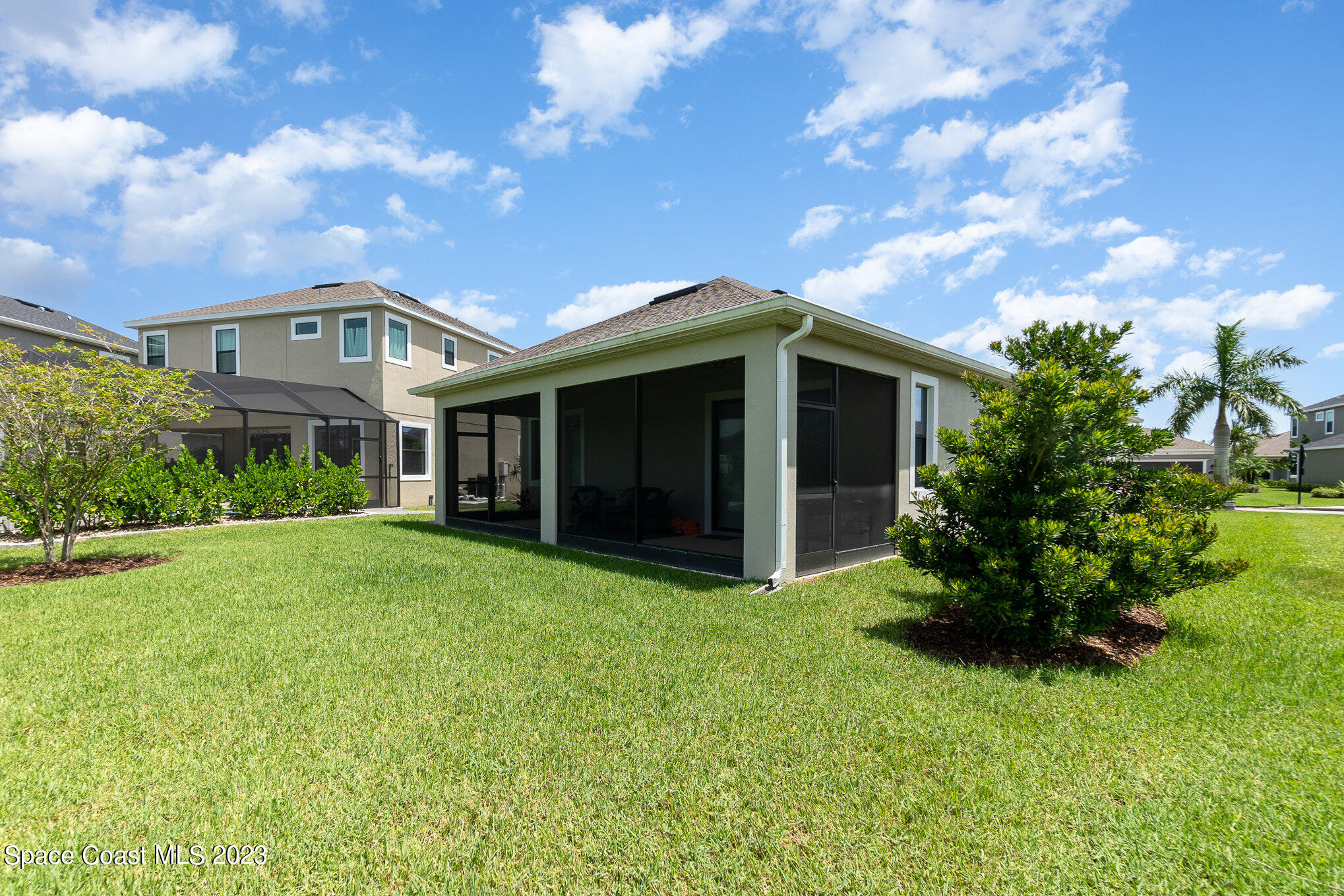 3349 Ribbon Grass Drive Melbourne, FL 32940 - Photo 25 of 45 a front view of a house with a garden