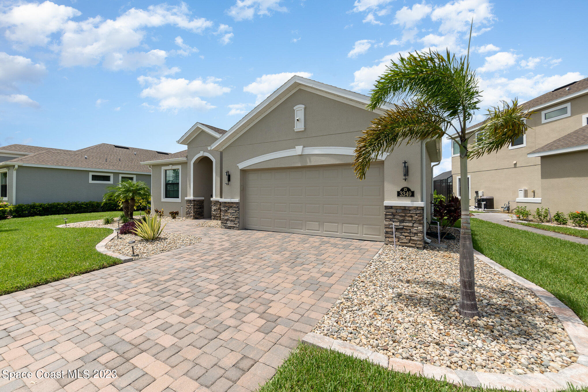 3349 Ribbon Grass Drive Melbourne, FL 32940 - Photo 27 of 45 a front view of a house with a yard