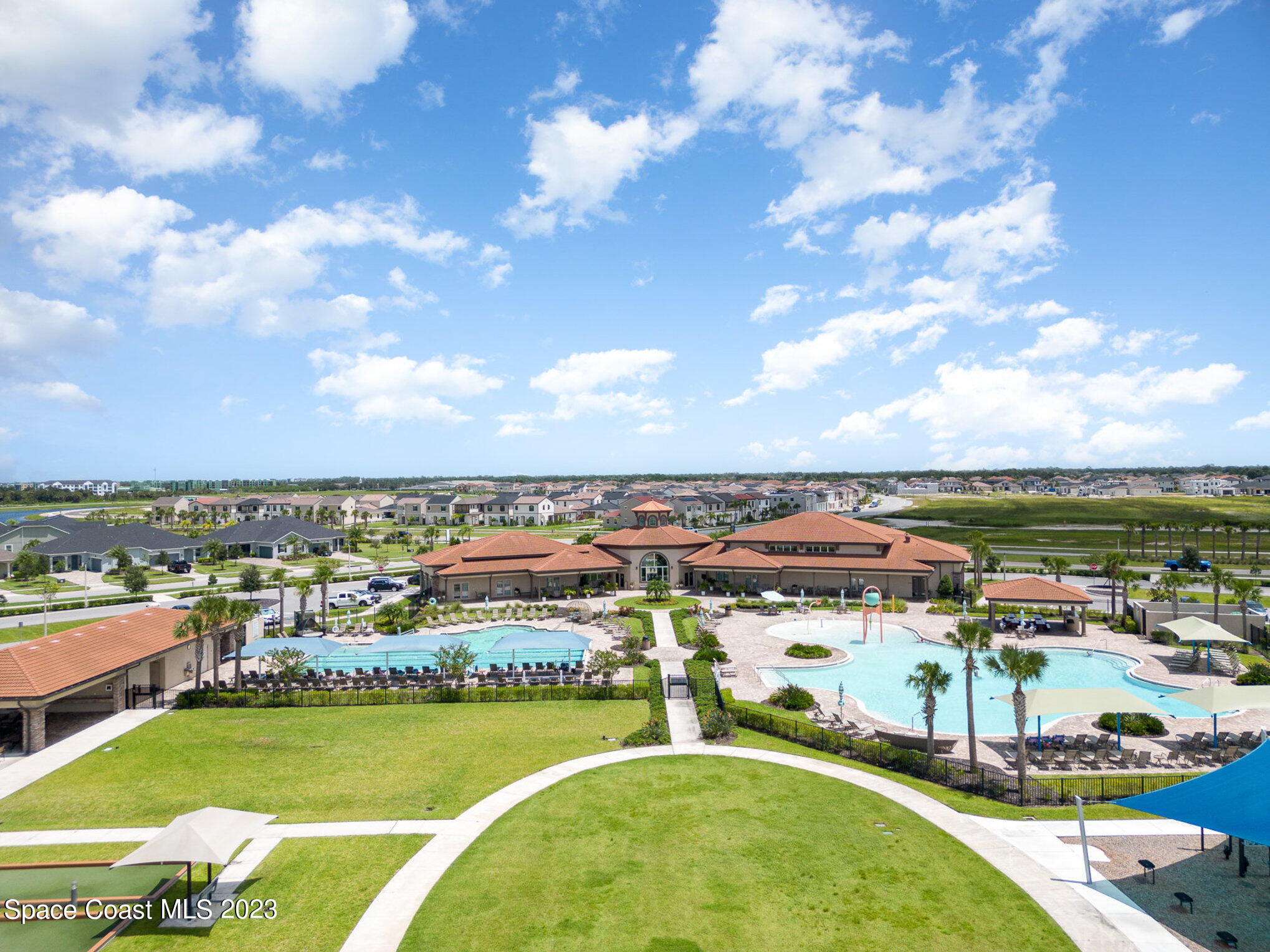3349 Ribbon Grass Drive Melbourne, FL 32940 - Photo 33 of 45 a view of a swimming pool with an ocean view