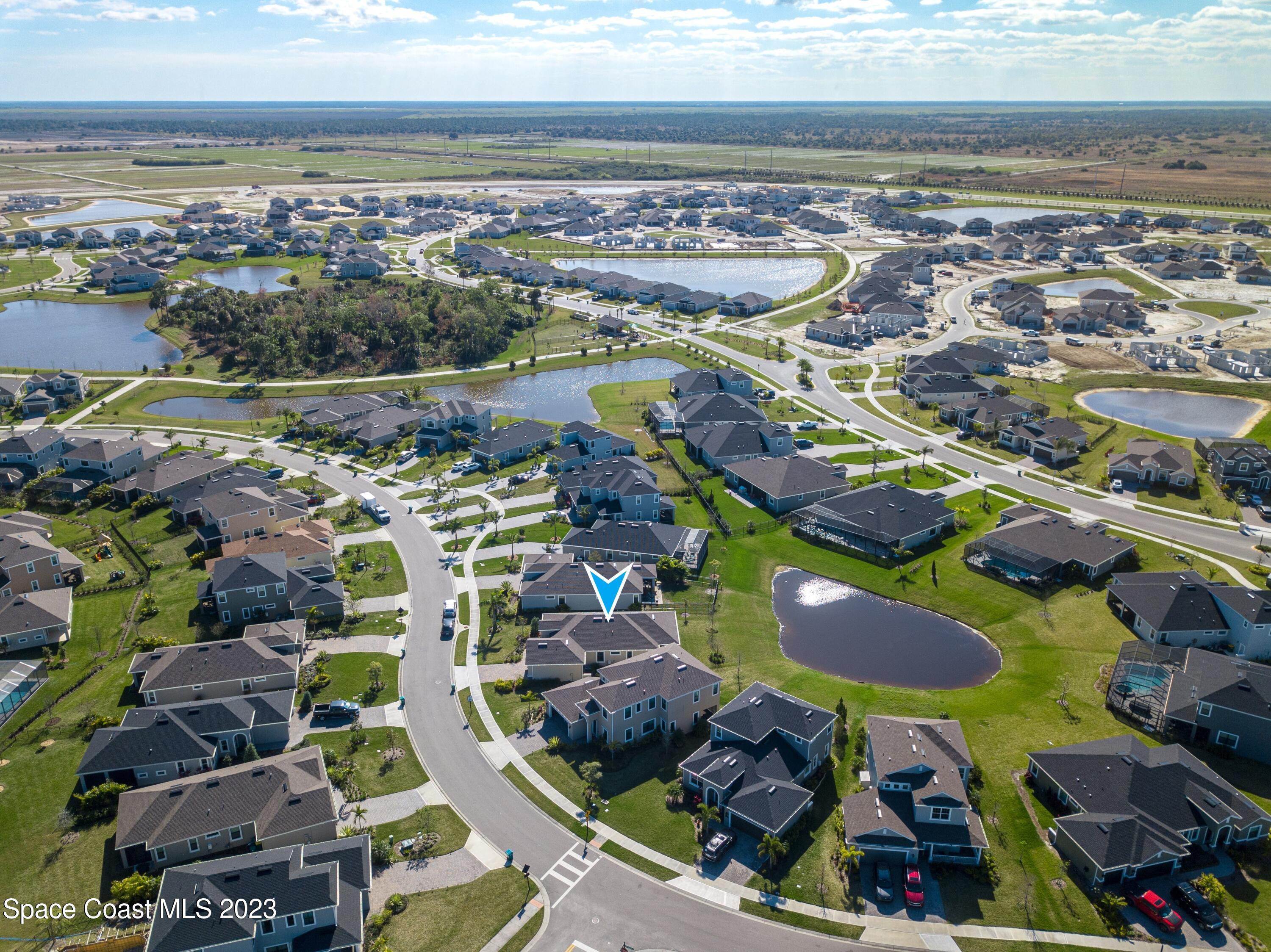 3349 Ribbon Grass Drive Melbourne, FL 32940 - Photo 38 of 45 a view of a city with an ocean