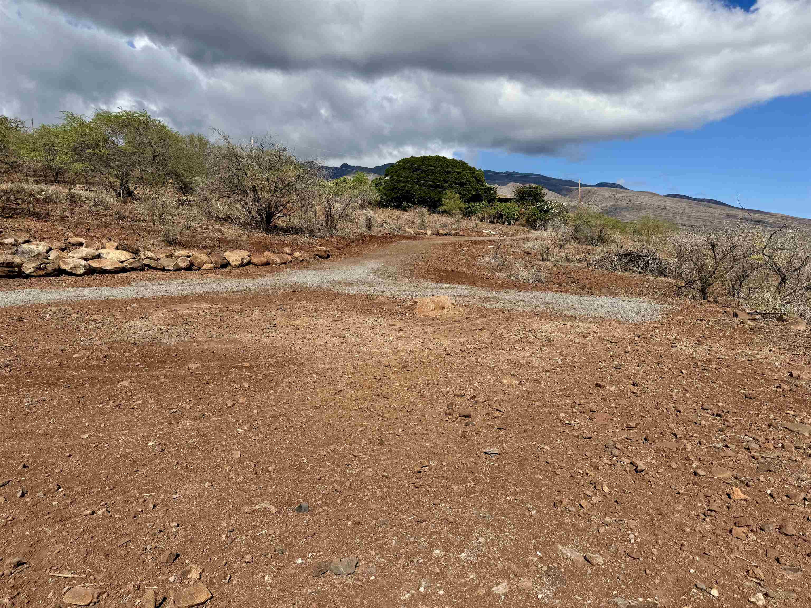 235 Ulua Road, Unit 159 Kaunakakai, HI 96748 - Photo 14 of 14 a view of a town with mountains in the background