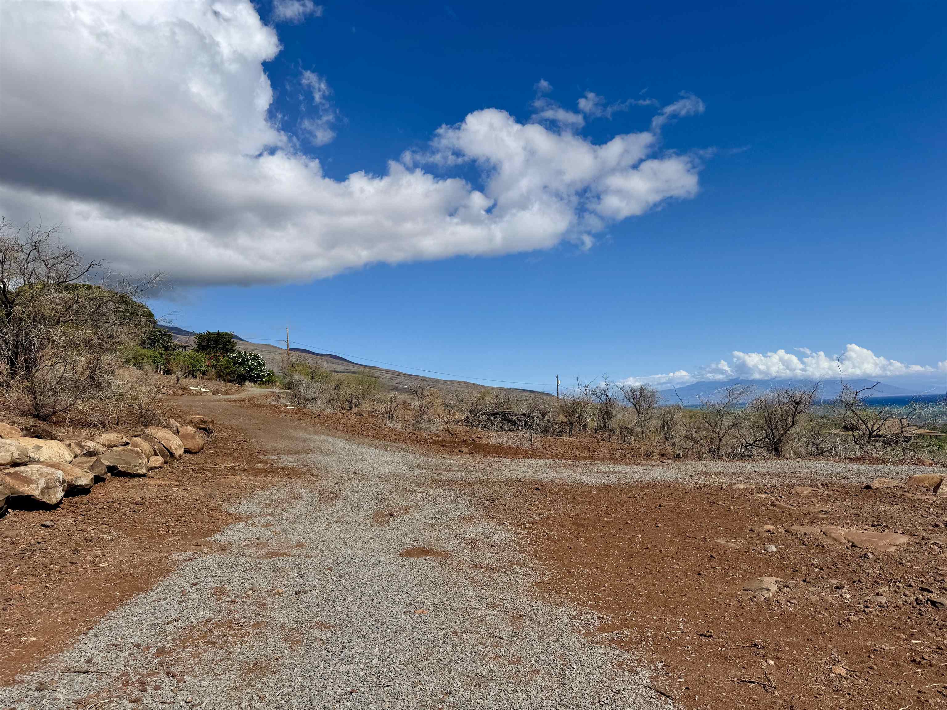 235 Ulua Road, Unit 159 Kaunakakai, HI 96748 - Photo 10 of 14 a view of a yard with a mountain