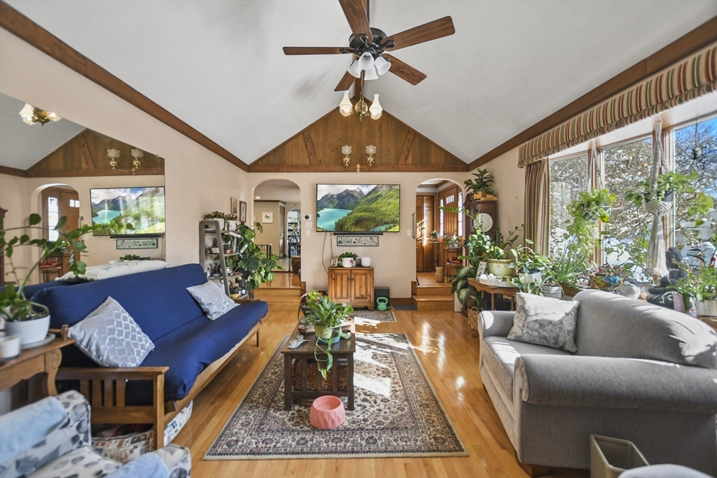 264 John Parker Road Falmouth, MA 02536 - Photo 12 of 41 a living room with furniture a rug and a chandelier