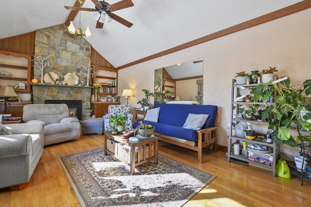 264 John Parker Road Falmouth, MA 02536 - Photo 13 of 41 a living room with furniture and a fireplace