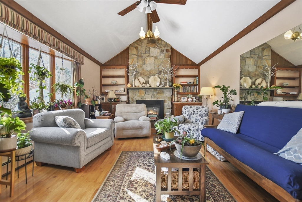 264 John Parker Road Falmouth, MA 02536 - Photo 14 of 41 a living room with furniture fireplace and a large window