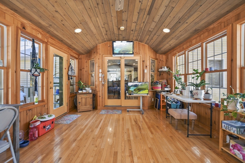 264 John Parker Road Falmouth, MA 02536 - Photo 17 of 41 a living room filled with furniture hardwood floor and a large window