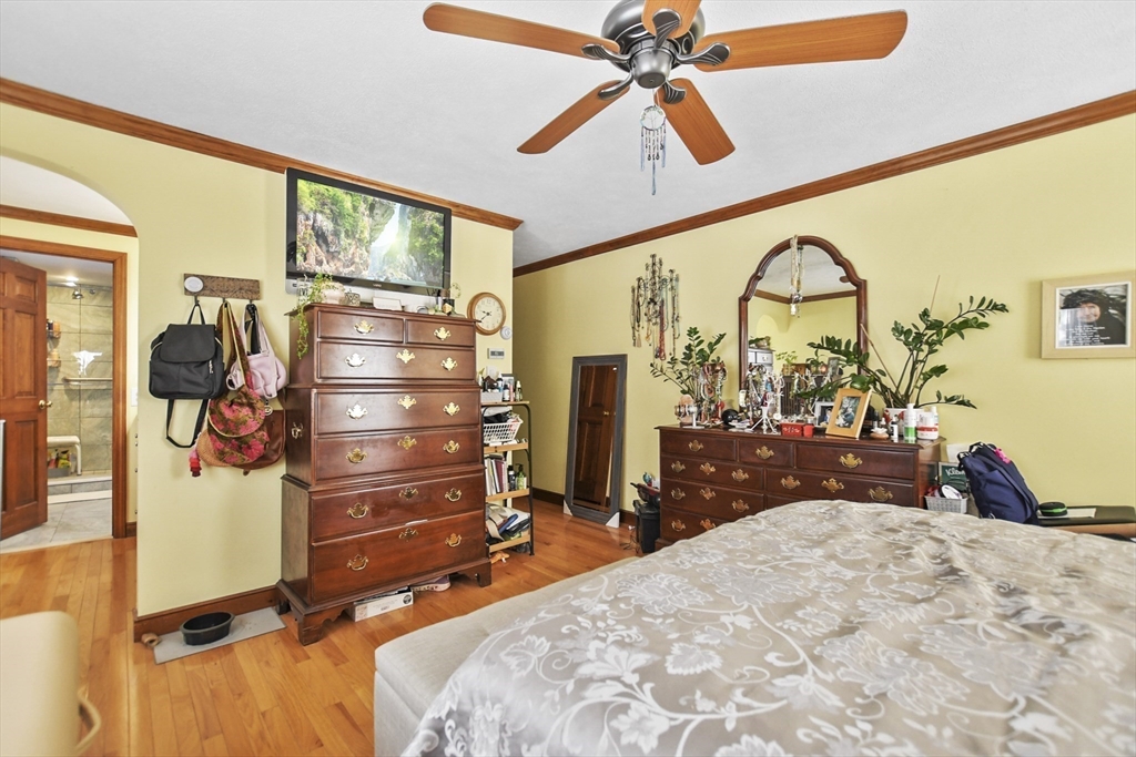 264 John Parker Road Falmouth, MA 02536 - Photo 18 of 41 a bed room with a bed and a mirror