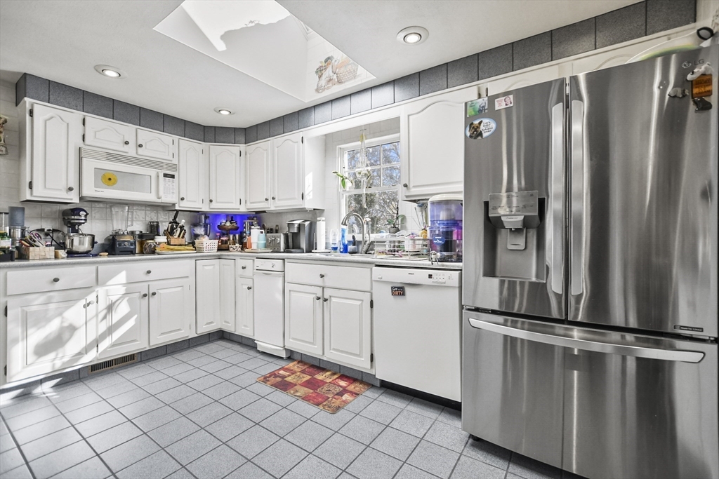 264 John Parker Road Falmouth, MA 02536 - Photo 2 of 41 a kitchen with stainless steel appliances a refrigerator sink and cabinets