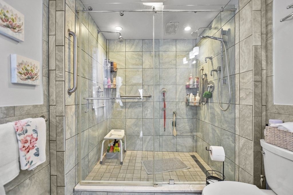 264 John Parker Road Falmouth, MA 02536 - Photo 23 of 41 a bathroom with a bathtub and a shower