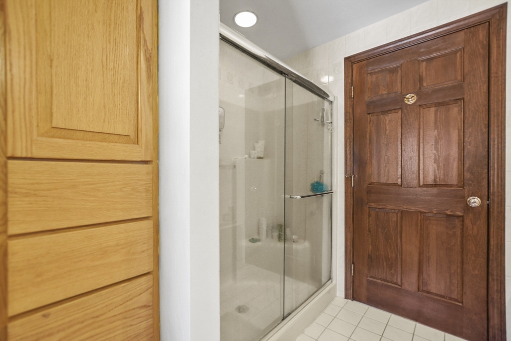 264 John Parker Road Falmouth, MA 02536 - Photo 26 of 41 a bathroom with a glass shower door
