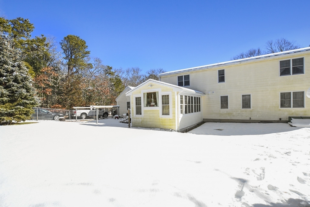 264 John Parker Road Falmouth, MA 02536 - Photo 32 of 41 a front view of a house with a yard