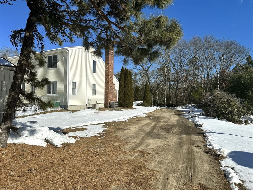 264 John Parker Road Falmouth, MA 02536 - Photo 36 of 41 a view of a white house with a snow on the road