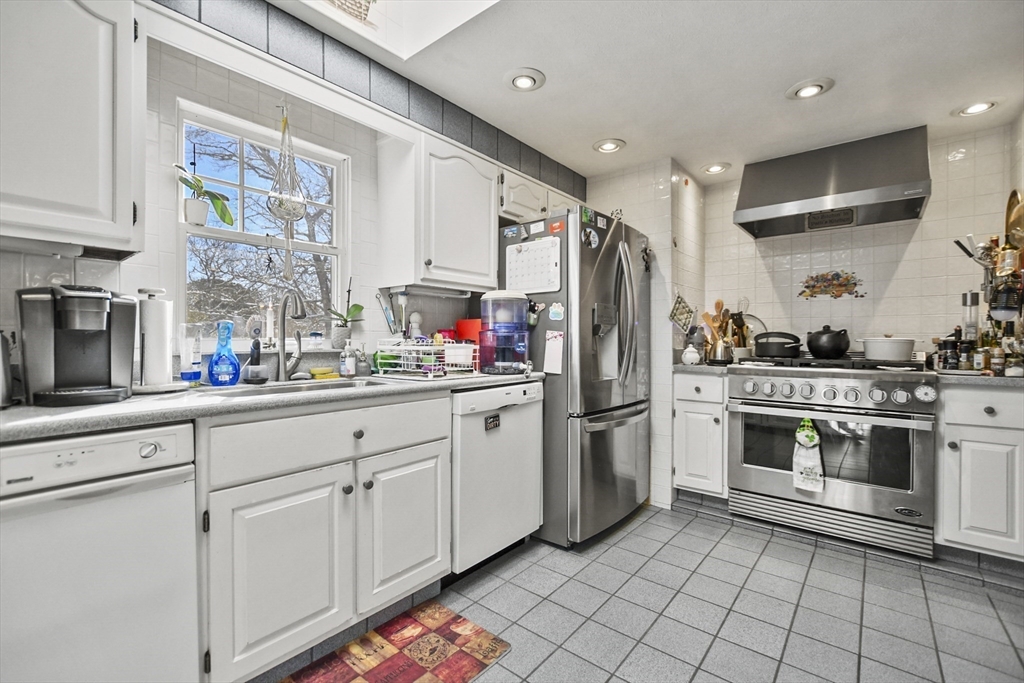 264 John Parker Road Falmouth, MA 02536 - Photo 4 of 41 a kitchen with stainless steel appliances a stove a sink and a refrigerator