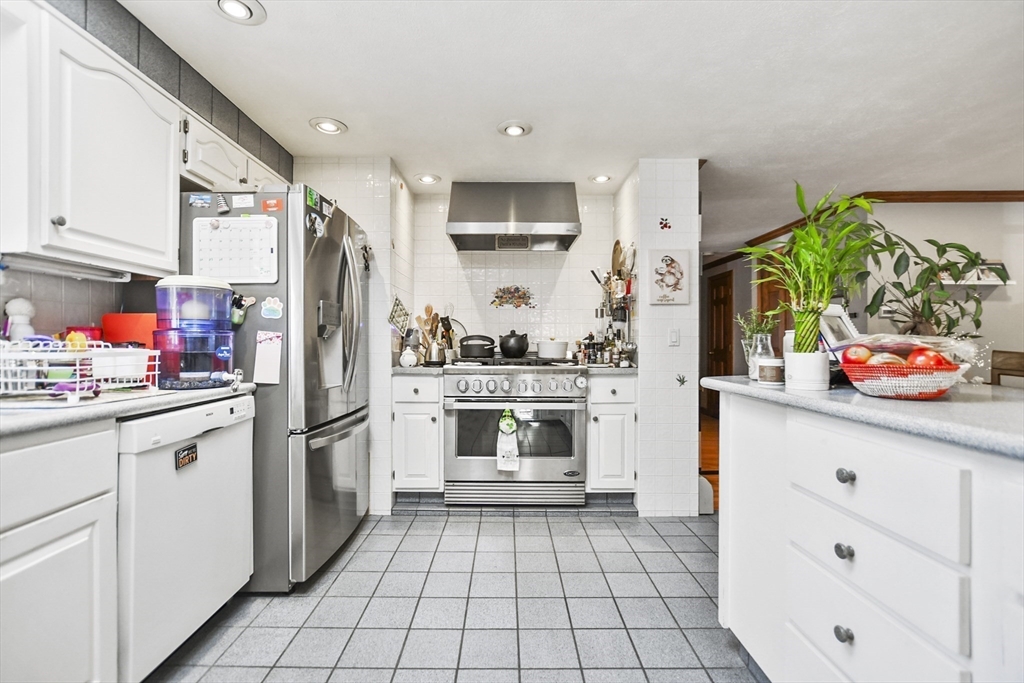 264 John Parker Road Falmouth, MA 02536 - Photo 5 of 41 a kitchen with stainless steel appliances a refrigerator sink and cabinets