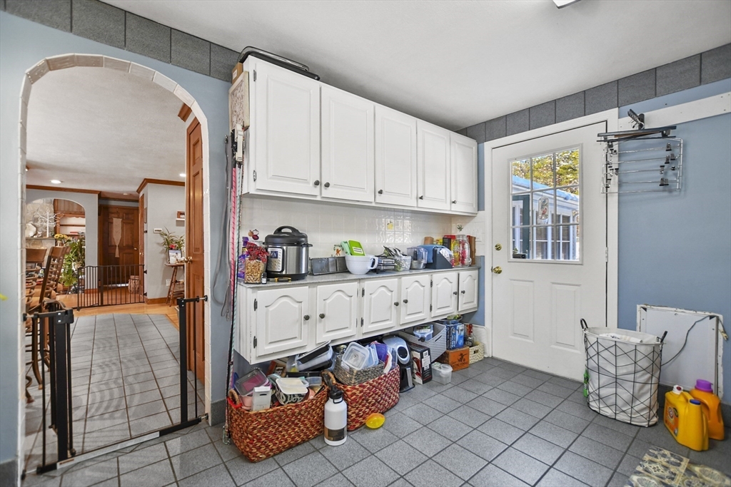 264 John Parker Road Falmouth, MA 02536 - Photo 6 of 41 a storage room with lots of clutter and cabinets