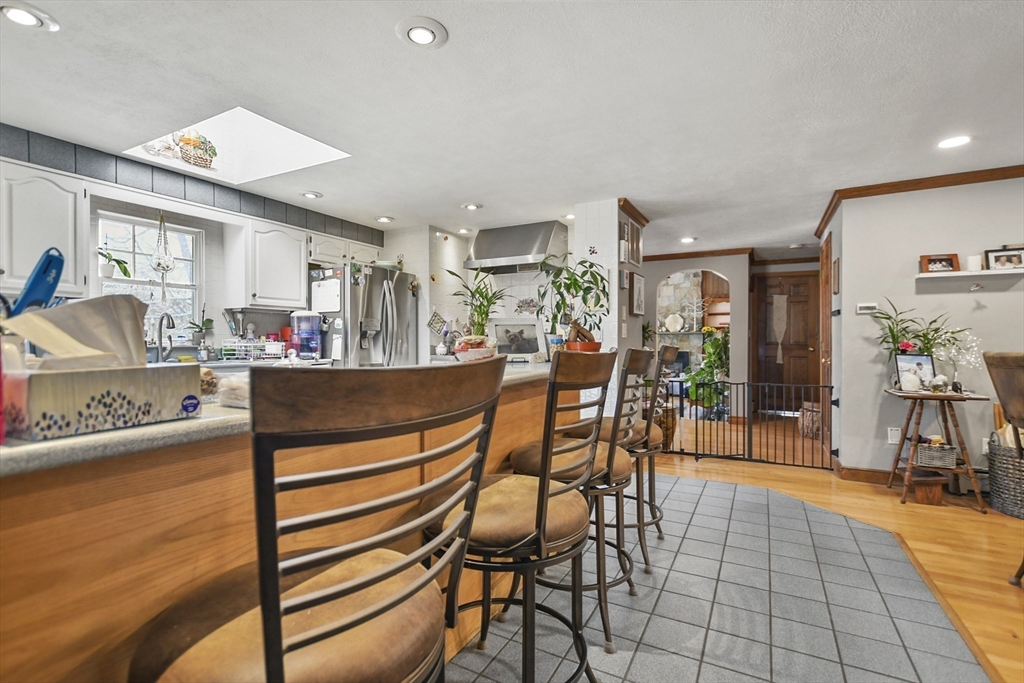 264 John Parker Road Falmouth, MA 02536 - Photo 8 of 41 a dining room with furniture and wooden floor