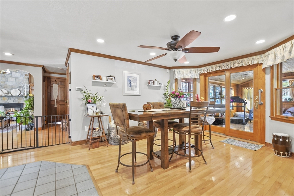 264 John Parker Road Falmouth, MA 02536 - Photo 9 of 41 a view of a dining room with furniture and a potted plant