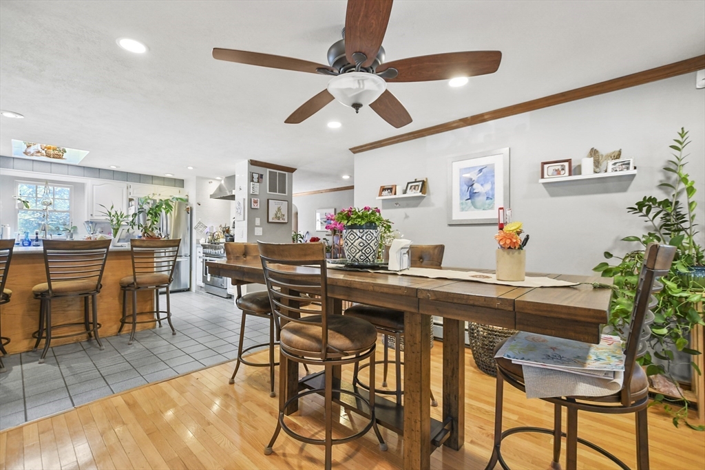 264 John Parker Road Falmouth, MA 02536 - Photo 10 of 41 a view of a dining room with furniture and chandelier