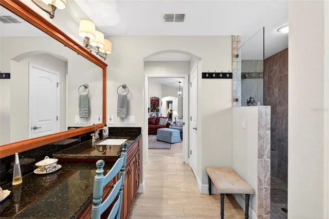 a bedroom with a bed and ceiling fan