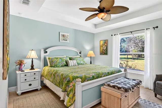 a living room with furniture a rug and a chandelier
