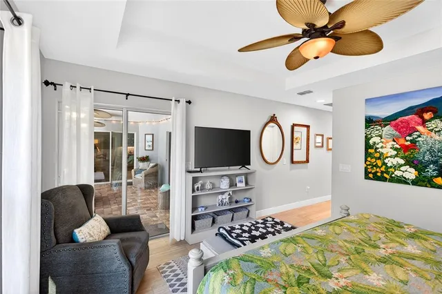 a kitchen with stainless steel appliances kitchen island granite countertop a stove refrigerator and chairs