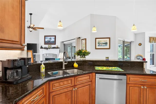 a kitchen with stainless steel appliances granite countertop a stove and a refrigerator