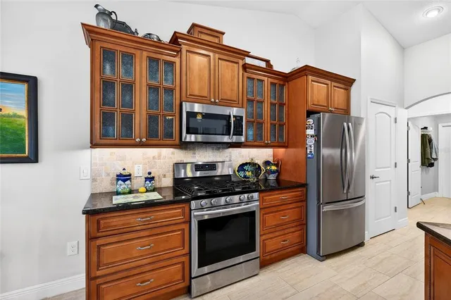 a living room with furniture and a gym machine