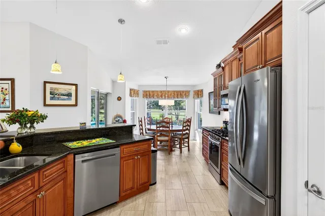 a view of a room with wooden floor and windows