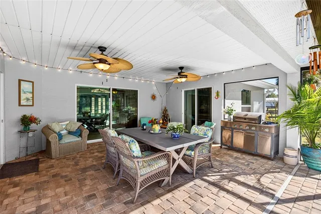 swimming pool view with a seating space