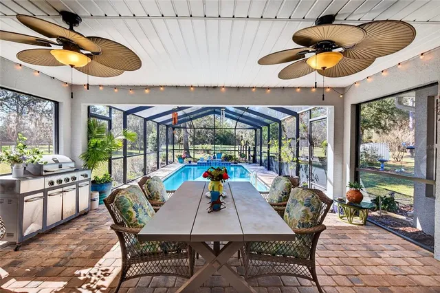 a front view of house with yard and trees in the background