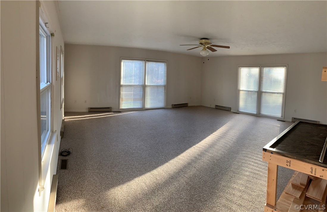 67 Mahan Road Farmville, VA 23901 - Photo 17 of 49 an empty room with windows and ceiling fan
