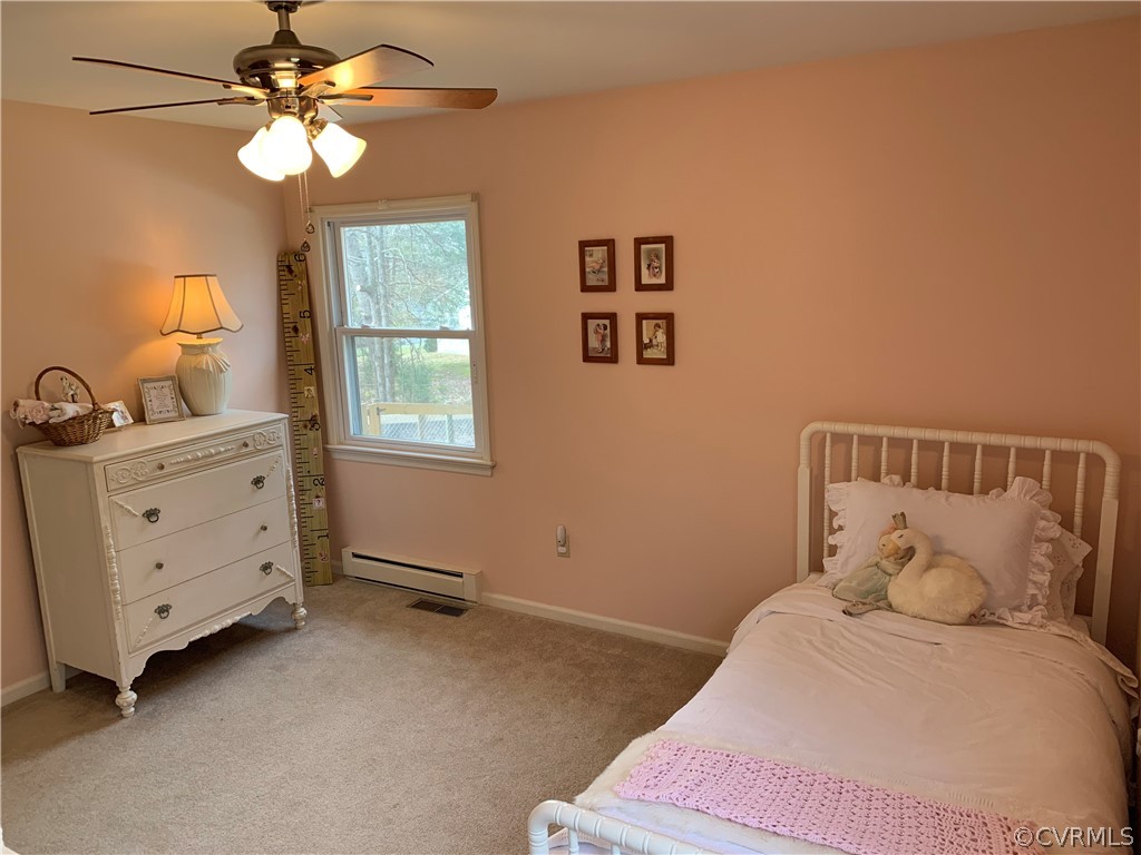 67 Mahan Road Farmville, VA 23901 - Photo 33 of 49 a bedroom with a bed and a chandelier fan