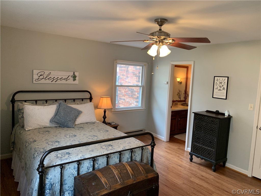 67 Mahan Road Farmville, VA 23901 - Photo 39 of 49 a bedroom with a bed and wooden floor