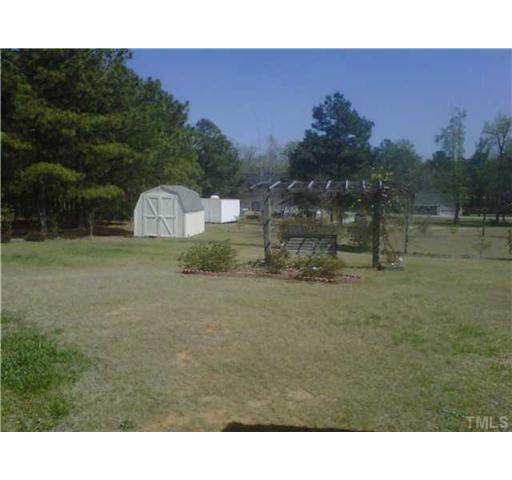 26 Chic Ennis Road Coats, NC 27521 - Photo 3 of 6 8 x 12 Outbuilding to convey. Swing set does not convey.