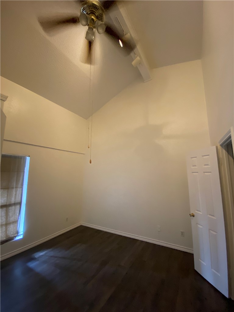 2401 Leon Street, Unit 206 Austin, TX 78705 - Photo 12 of 16 an empty room with wooden floor and cabinet