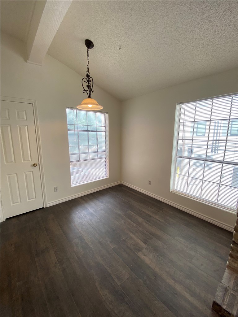 2401 Leon Street, Unit 206 Austin, TX 78705 - Photo 5 of 16 wooden floor in an empty room with a window