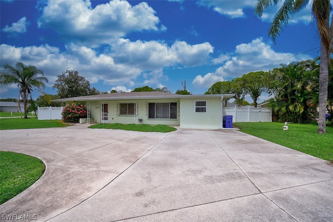 4378 Pompano Road Venice, FL 34293 - Photo 29 of 33 a front view of house with yard and green space