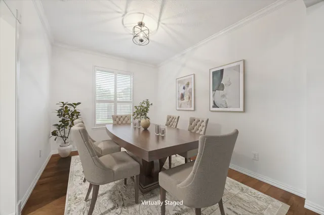 a view of a dining room with furniture and wooden floor