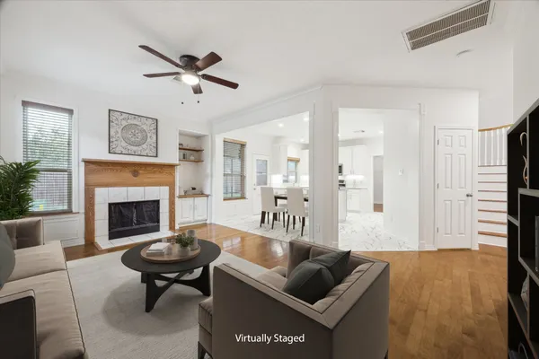 a living room with furniture and a fireplace